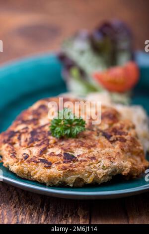 Austrian cheese dumpling with sauerkraut Stock Photo