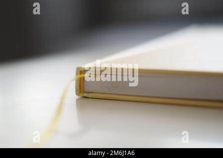 Yellow hardcover book on a white background Stock Photo