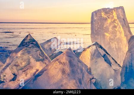 Sunset on frozen Lake Baikal Stock Photo