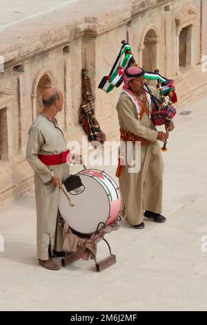 Jerash, Jordan - November 7, 2022: Jordanian bagpipe players in the roman theatre of the archeological site Stock Photo