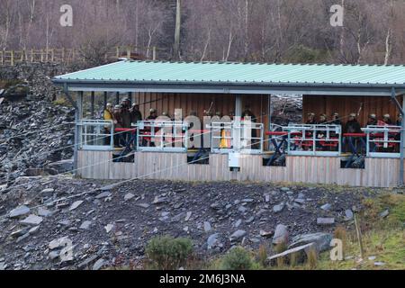 Zip world Penrhyn quarry Bethesda Wales is the fastest zip wire in the uk and nearly the longest at 2km and speeds of around 100mph Stock Photo