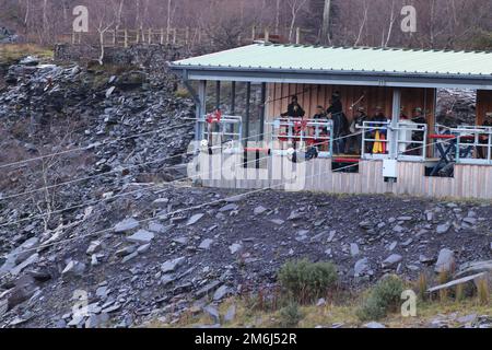 Zip world Penrhyn quarry Bethesda Wales is the fastest zip wire in the uk and nearly the longest at 2km and speeds of around 100mph Stock Photo