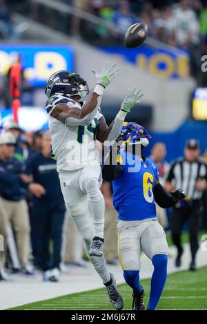 Inglewood, United States. 08th Dec, 2022. Las Vegas Raiders running back  Zamir White (35) and Los Angeles Rams cornerback Derion Kendrick (6)  exchange jerseys after an NFL game on Thursday, Dec. 8