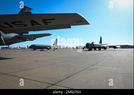 A group of three KC-135 Stratotankers from the 54th Air Refueling Squadron at Altus Air Force Base, Oklahoma, sit on the flightline at Roswell Airport, New Mexico, April 28, 2022. During Task Force Red Mammoth, KC-135 aircrew received in-flight training including air refueling and patterns. Stock Photo