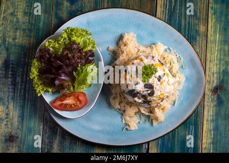 Austrian bread dumpling on sauerkraut Stock Photo