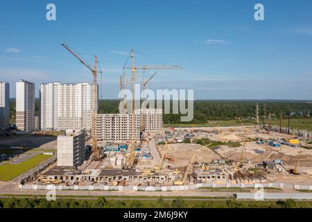 Building crane and buildings under construction Stock Photo