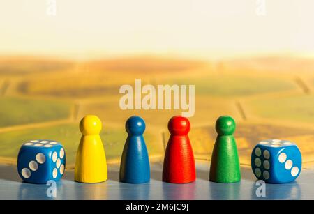 Two blue dices and colored chips on board Stock Photo