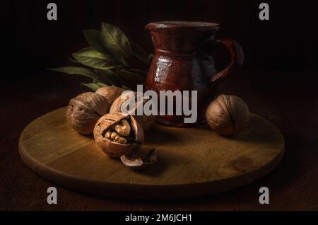 Walnuts on a dark background in a rustic style Stock Photo