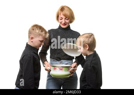 Mom made soup, the kids opened the pot and didn't like the food Stock Photo