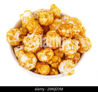 Sweet caramel candy popcorn in a bowl top view Stock Photo