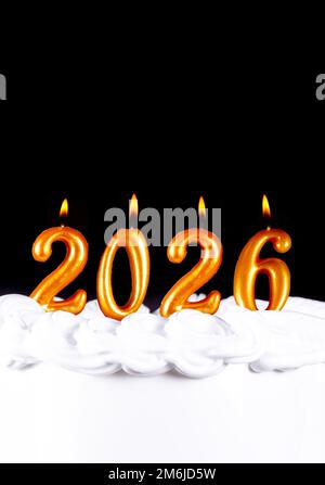 Golden candles write numbers flame Happy new year 2026 Stock Photo