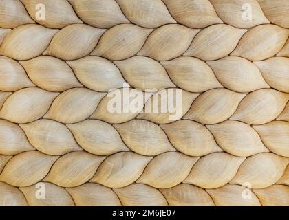 Traditional ecological consistent cladding of a wall with brown wooden larch fish scales, wood shingles, clapboard, clapboard te Stock Photo