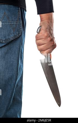 Person wears blue jeans hairy skin chef holding kitchen knife by hand Stock Photo