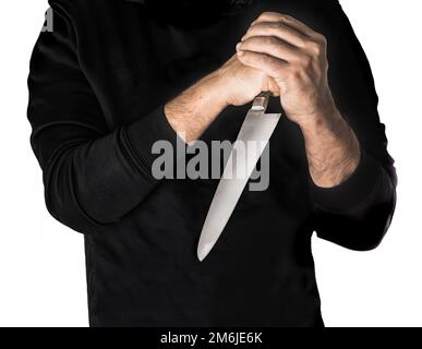 Person in hoodie hairy skin chef holding kitchen knife by two hands Stock Photo