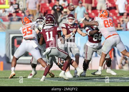 Tampa FL USA;  Mississippi State Bulldogs quarterback Will Rogers (2) passes the ball to wide receiver Jaden Walley (11) during the ReliaQuest Bowl ga Stock Photo