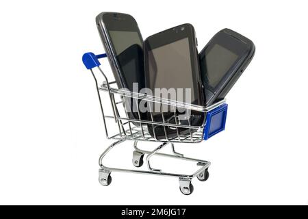 Phones in shopping cart Stock Photo