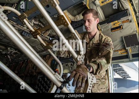 U.S. Air Force Senior Airman Jaxon Brown, an aerial gunner with the 4th Special Operations Squadron, participates in a training sortie on an AC-130J Ghostrider, April 27, 2022 at Hurlburt Field, Florida. The 4 SOS regularly performs training sorties on the AC-130J in order to ensure readiness to perform special operations missions any time, any place. Stock Photo