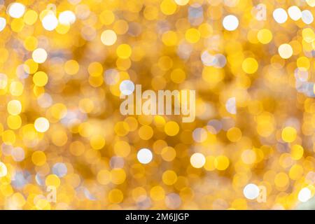 Bright bokeh overflow in yellow shades. Optical defocus effect. Background image Stock Photo