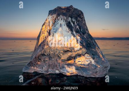 Sunlight refracted in piece of ice Stock Photo