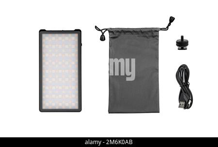 A small portable LED panel on the battery. Lighting device for photo and video filming. Isolate on a white background. Stock Photo