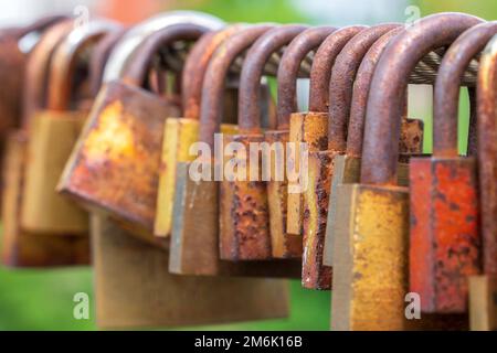 Love locks hang on the chain bridge in Bamberg Stock Photo