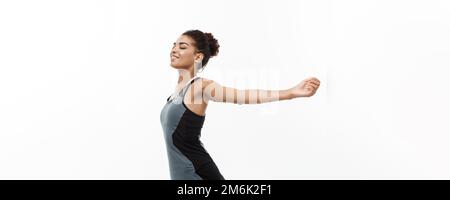 Healthy and Fitness concept - Portrait of young beautiful African American with her hands outstretched and closing eyes feeling Stock Photo