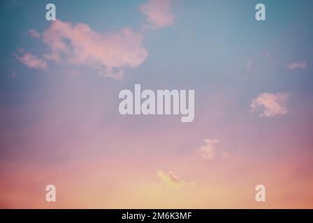 Sunset sky with few purple clouds, sky only background Stock Photo