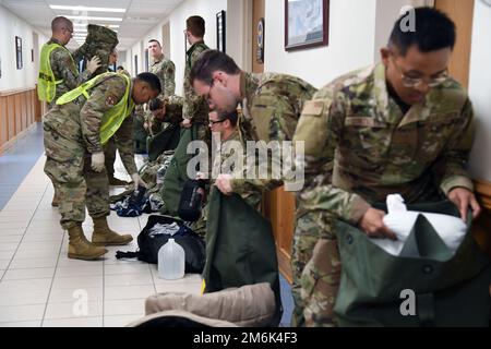 Members of the 335th Training Squadron sheltering team in-process Airmen into the Allee Hall shelter during a hurricane exercise at Keesler Air Force Base, Mississippi, April 29, 2022. Keesler personnel participate in exercise scenarios in preparation for hurricane season. Stock Photo