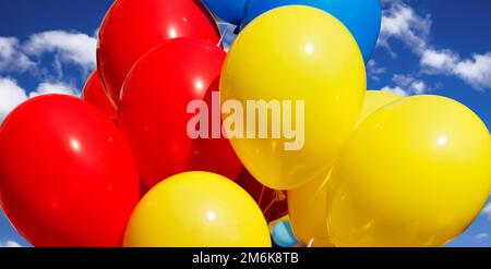 Multicolored balloons against the sky Stock Photo