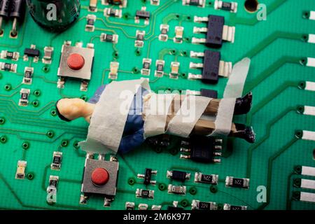 Tiny figurine of man model  wrapped in bandages Stock Photo