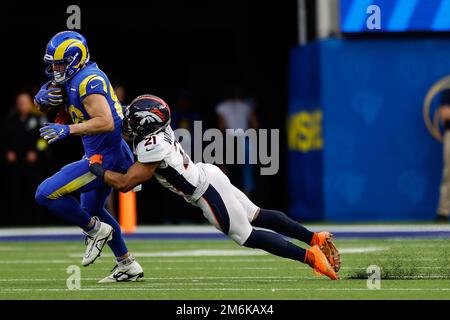 INGLEWOOD, CA - DECEMBER 25: Denver Broncos cornerback K'Waun Williams (21) holds on to Los Angeles Rams tight end Brycen Hopkins (88) during the Denv Stock Photo