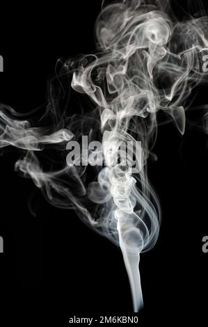 White smoke on black background Stock Photo