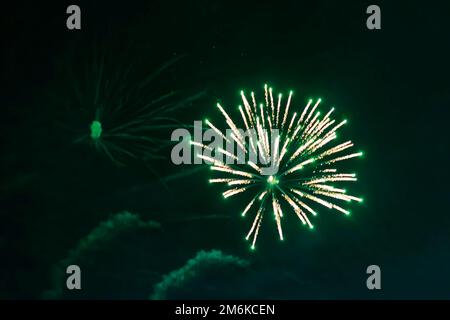 An explosion of bright single fireworks, against the background of the night sky. High quality photo Stock Photo