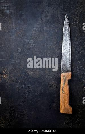 Old Knife on Rusty Metal Sheet Stock Photo