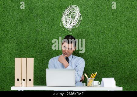 The grass business men to use notebook computer Stock Photo