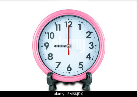 Beautiful pink clock show time of nine o'clock isolated on white background. Stock Photo