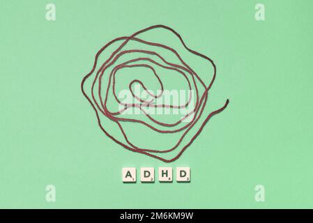 Scrabble Thread ADHD formed of scrabble blocks with tangled thread Stock Photo - Alamy