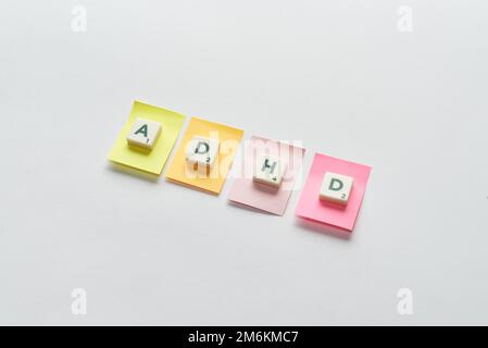 ADHD formed of scrabble blocks on sticky notes Stock Photo - Alamy