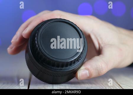 the back of the chinese lens on the table and colored background Stock Photo