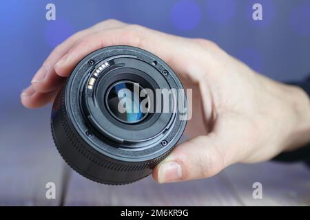 the back of the chinese lens on the table and colored background Stock Photo