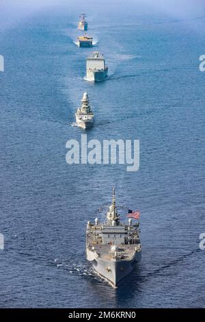 220501-N-TT059-1007 GULF OF ADEN (May 1, 2022) Amphibious command ship USS Mount Whitney (LCC 20), Italian Navy frigate Carlo Bergamini (F 590), guided-missile destroyer USS Gonzalez (DDG 66), expeditionary fast transport ship USNS Choctaw County (T-EPF 2) and British Royal Fleet Auxiliary RFA Lyme Bay (L 3007) sail in formation in the Gulf of Aden, May 1. Carlo Bergamini, the flagship for the European Union Naval Force's Combined Task Force (CTF) 465, operated in cooperation with the other vessels of CTF 153, a Combined Maritime Forces task force focused on maritime security and capacity buil Stock Photo