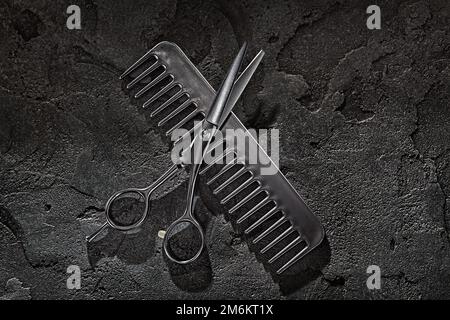 Black Tools Of Barber. Barber Shop. Professional Hair Cutting Scissors Hairdresser Carbon Comb. On Black Background Stock Photo