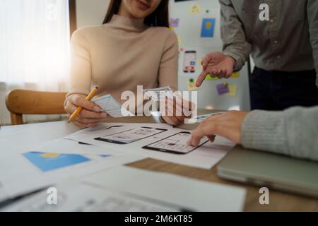 Young Asian Start up new business working at creative office. Modern start-up business team. Co-workers ui, ux startup small business Stock Photo