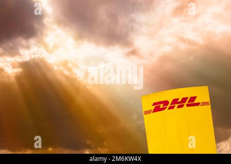 Advertising and company signboard of the company DHL Stock Photo - Alamy