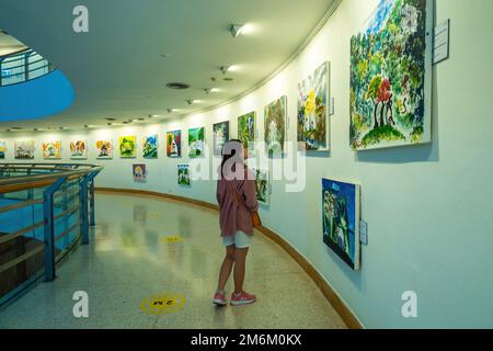 Bangkok, Thailand - Aug 17 2022: People visit the photo exhibition in Bangkok Art and Culture Center (BACC) Stock Photo