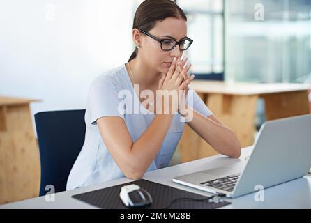 Developing tomorrows tech today. a designer at their workstation in an office. Stock Photo