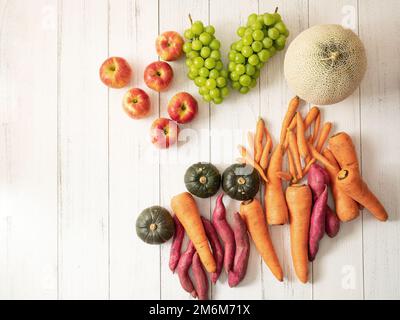 Various vegetables and fruits on wooden background Stock Photo