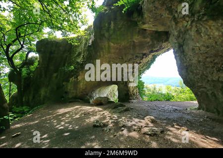 The natural stone bridge or arch at Happurg is a wonder of nature and was formed by erosion. Stock Photo