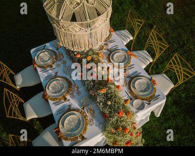Table for banquet decorated with flowers Stock Photo