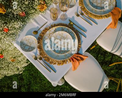 Served banquet table with empty plates Stock Photo